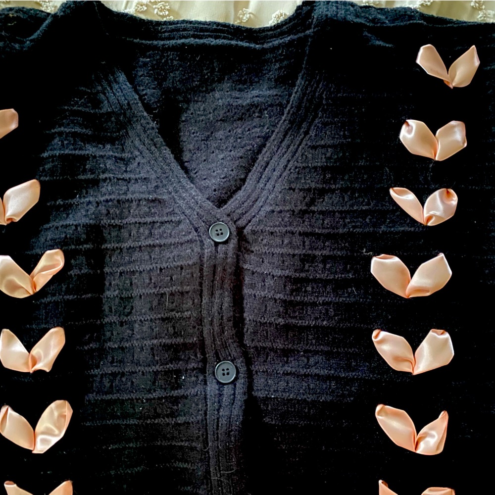 Cute Black Cardigan with pink satin ribboning down sleeves and front. Cider.